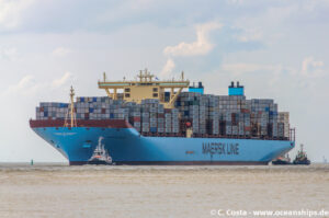 The Marstal Maersk laden with cargo. notice how much less of the burgundy paint below the Maersk blue you can see. That's the "draft", or part that rides below the waterline.
